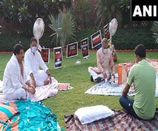 Rajya sabha deputy chairman harivansh brought tea for the rajya sabha mps who are protesting at gandhi statue against their suspension from the house